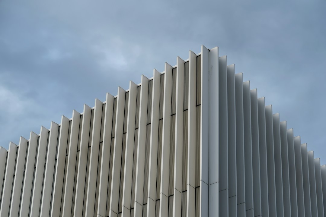 Aluminium window louvers - building corner with vertical fins