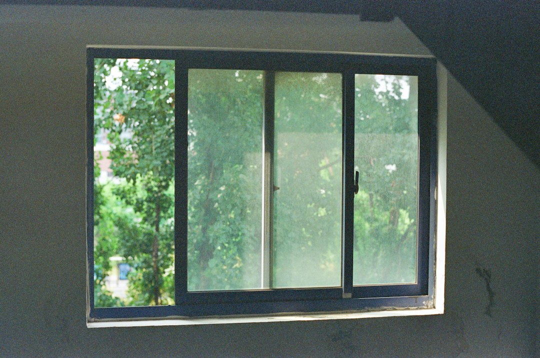 Aluminium window with slim frame and garden view
