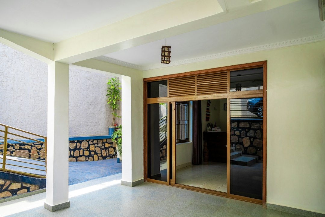 Wood finish aluminium doors opening onto a patio